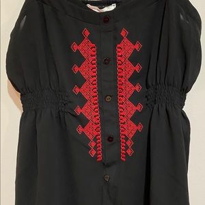 Semi-sheer black and red sleeveless blouse